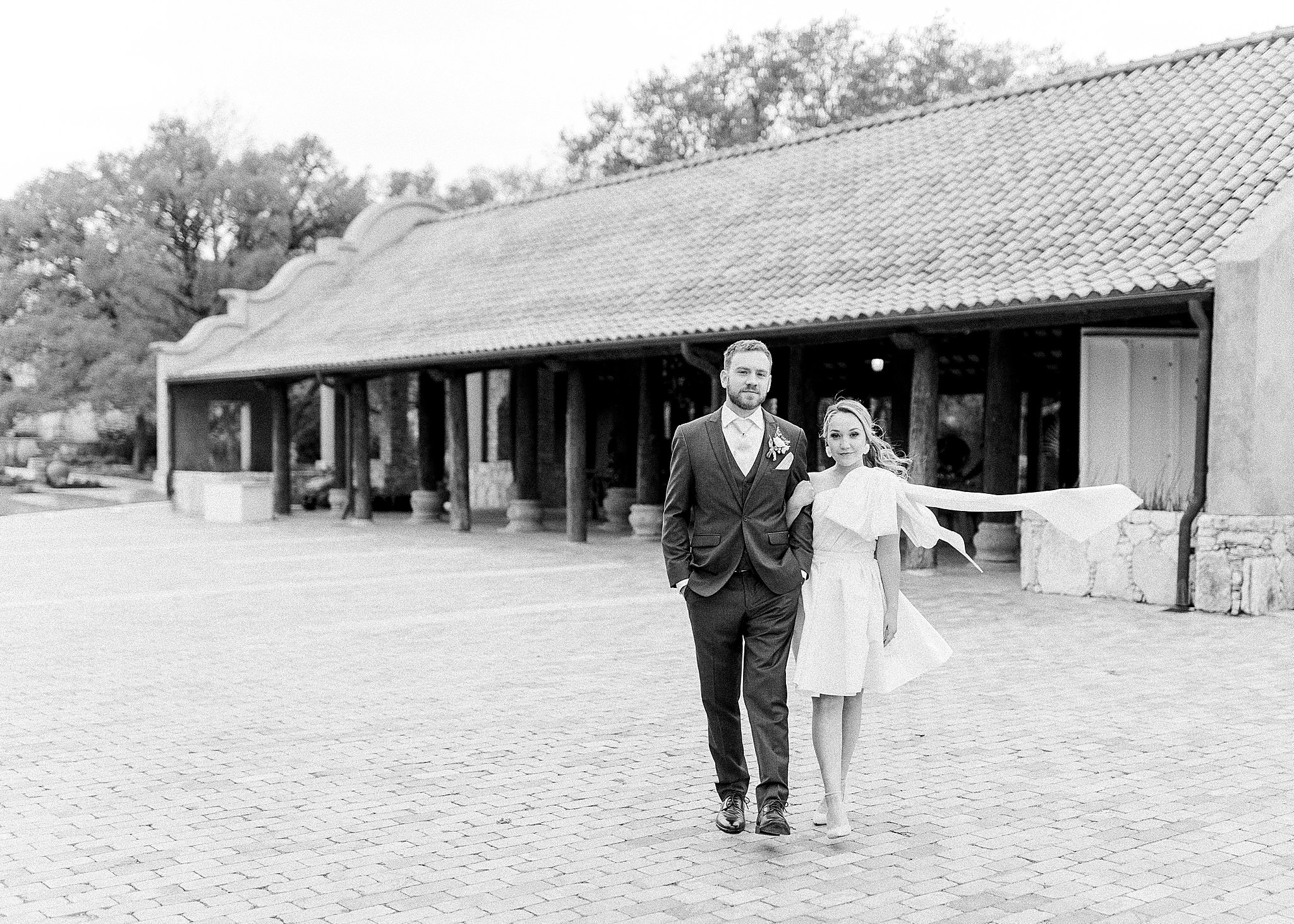 ATX wedding venue and reception hall, black-and-white bride and groom at Camp Lucy