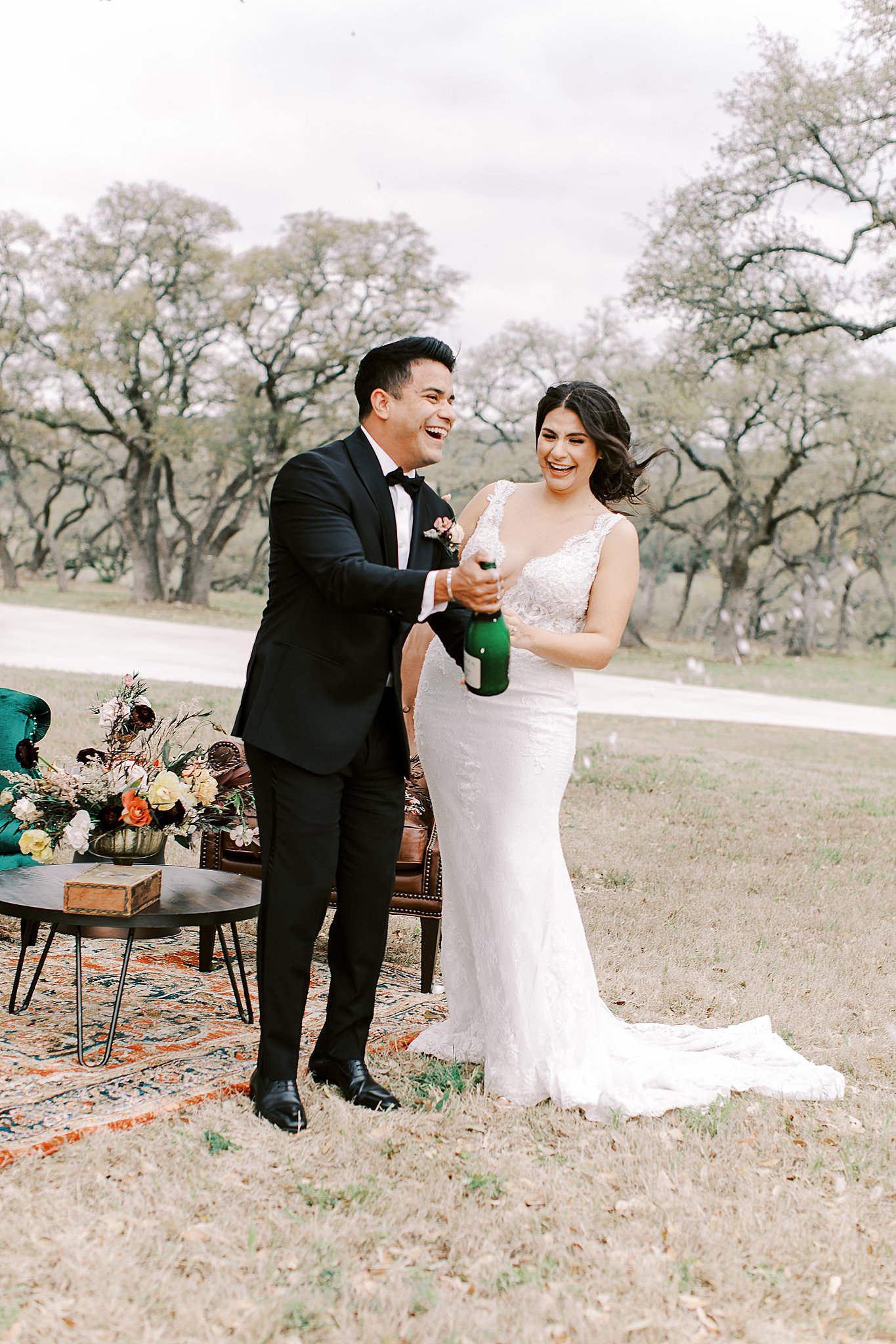 bride and groom celebrate with champagne outdoor Autumn wedding
